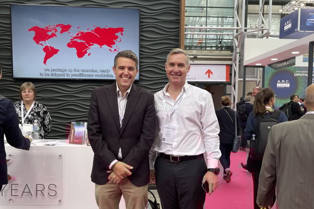 Gordon Von Sichart of Oculate, and Christopher Pearce of Sterimedix, smiling at the Sterimedix booth at ESCRS2025